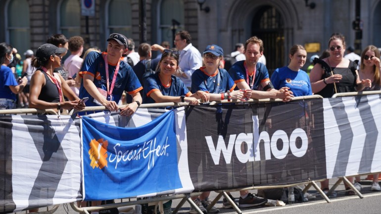 A picture of the Special Effect team cheering the runners on from the sidelines.