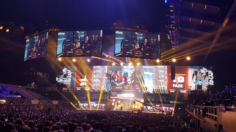 Mid-game picture of Astralis versus FaZe, taken from the far back right hand corner of the stadium.