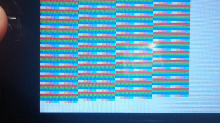 A picture of the PlayStation Portable Developer Kit, with a very buggy rendering from one of the earlier versions of the application.